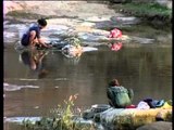 Maldhari women doing manual laundry on river side