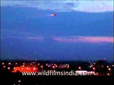 Flight approaching Indira Gandhi International Airport's runway at night, Delhi