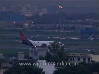 Planes lining up on runway at Delhi airport - archival from 1990's