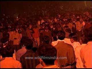 Roadside Entertainment - performer entertains audience by playing with fire