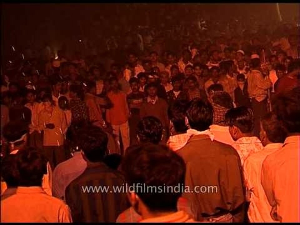 Roadside Entertainment - performer entertains audience by playing with fire