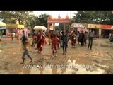Fast motion of People walking on a wet ground of Durga Puja venue