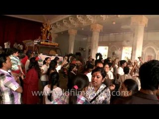 Devotees loading idols of Gods on the trucks