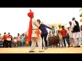 Girl performing dance with folk dancer at Surajkund mela