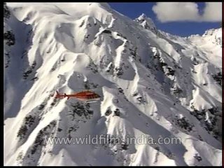 Chopper flying over the Himalayan Mountains
