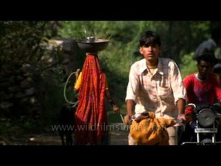 Woman and goat companionship in Rural Uttar Pradesh