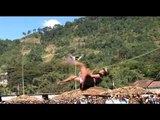 Acrobatic gymnastic stunt on a rope, Arunachal Pradesh