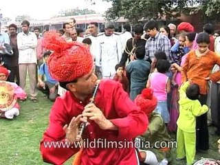 Folk musicians performing in open space at the Jaipur Elephant Festival