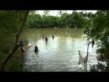 Fishing in a pond in Uttar Pradesh, India