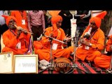 Artists in traditional attire compiling folk beats at Surajkund Mela