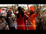 People dancing with folk music players at Surajkund Mela...
