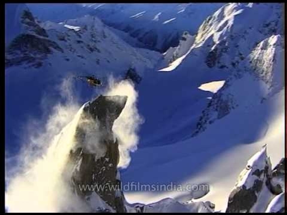 Aerial chopper dispersing snow