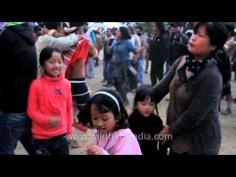 Children dancing with their parents at the Nagaland Hornbill festival
