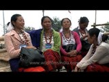 Attractive Ao Naga tribes-women from Nagaland sit around and chat