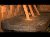 Giant wooden mortar and pestle in a traditional Sumi Naga hut!