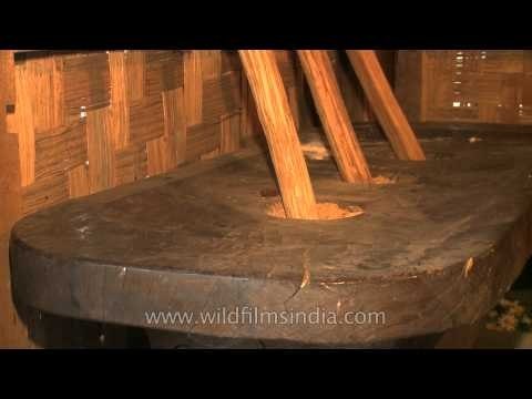 Giant wooden mortar and pestle in a traditional Sumi Naga hut!