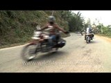 Tough men riding the muscular Royal Enfield Bullet motorbikes in Nagaland