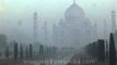 Taj Mahal mausoleum complex covered in mist
