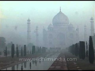 Taj Mahal mausoleum complex covered in mist