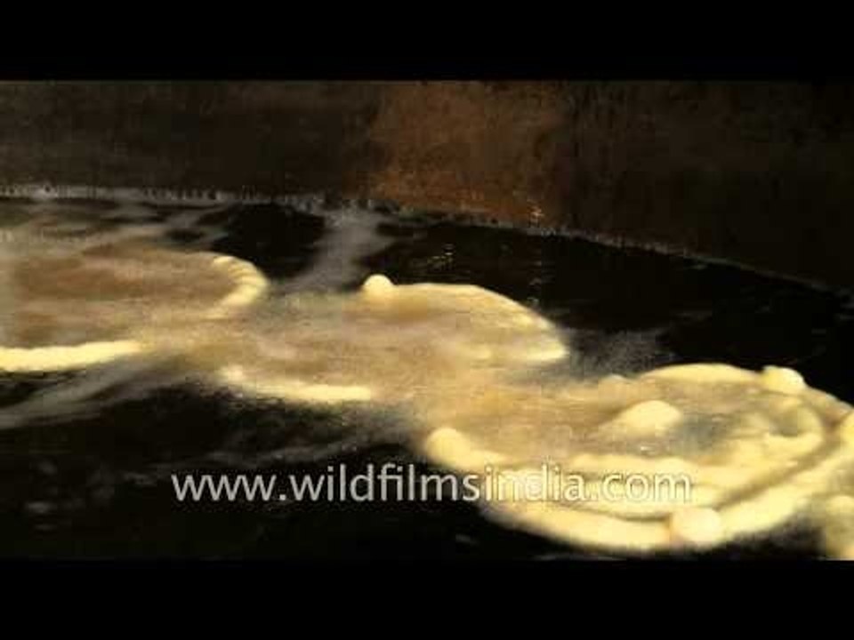 Jalebis being fried in a huge frying pan, Chandni Chowk