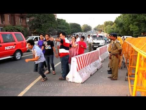 Police officers conduct a security sweep outside Commonwealth Games venues
