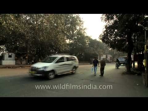 Vehicles crossing under the elevated metro tracks near Kalkaji Mandir metro station, Delhi