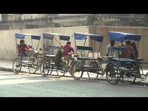 Rickshaw-pullers waiting for passenger outside Kailash colony Metro station, East Delhi