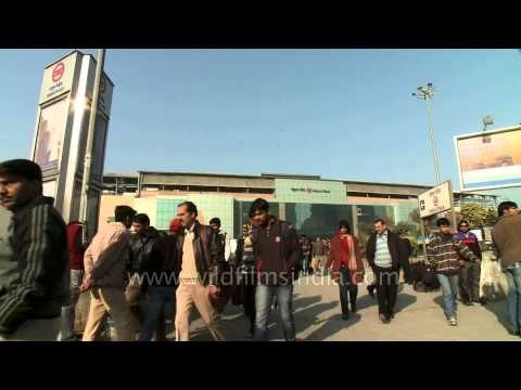 Commuters at Nehru Place Metro Station gate