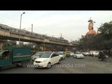 Huge statue of Lord Hanuman amid traffic and metro line - Karol Bagh, Delhi