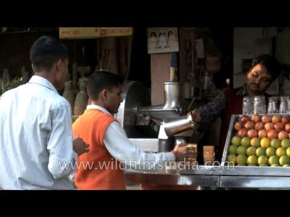 Freshly squeezed orange juice on the streets of...