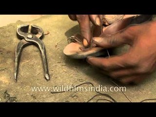 Sewing others broken shoes gives him food!