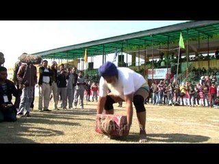 Oldman Hulk lifting heavy weight at the Kila Raipur rural olympics