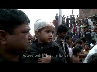 Tiny tots are also cut with blades for Muharram