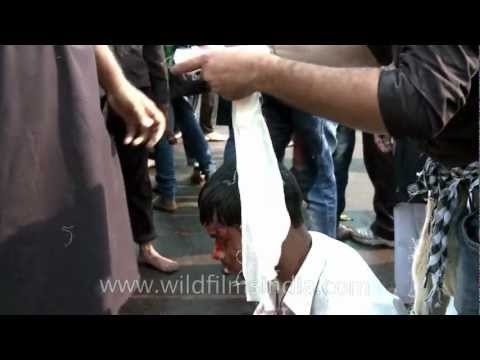 Indian Shia Muslims bleed as they flagellate themselves during a Muharram