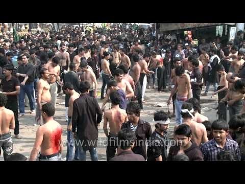 Muslims flagellate themselves during Muharram procession
