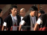Men from Adi tribes dancing to celebrate Arunachal Day at Pragati Maidan