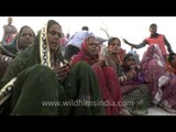 Group of women devotees singing hymns during Chhath Puja