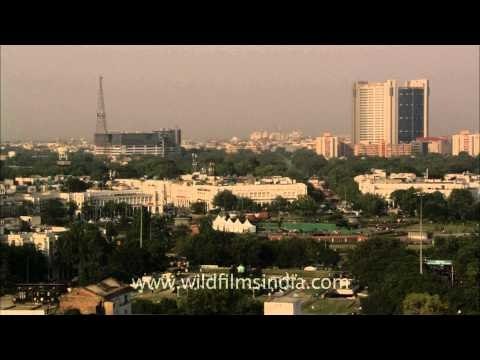 Ancient Jantar Mantar surrounded by tall office buildings of modern India