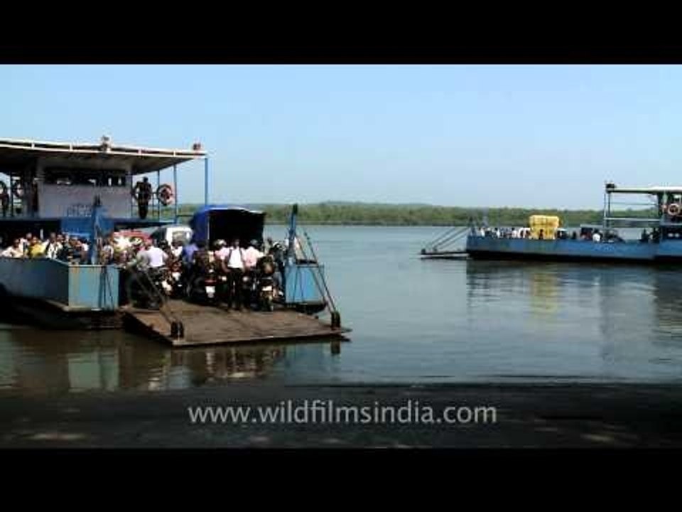 Taking Bikes and cars on Ferries across Mapusa River at Penha de France, Goa
