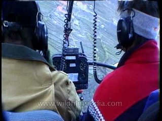 Landscape views of a Himalayan hill station from a helicopter cockpit