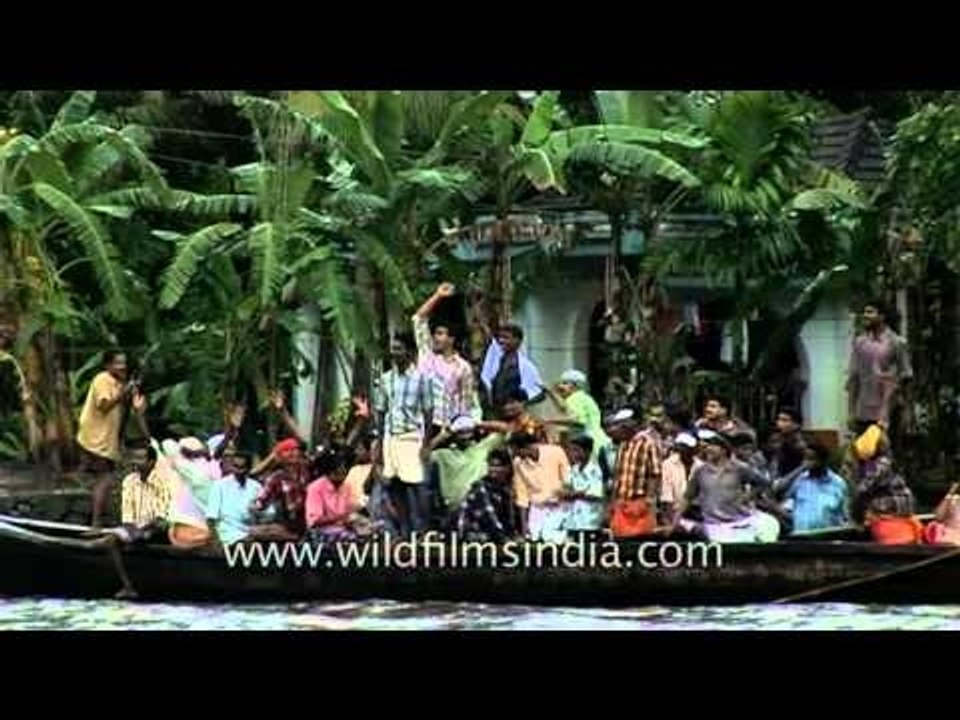 Audience in boats cheer the competitors at Nehru Trophy Boat Race, Kerala