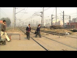 Children crossing railway track at Hazrat Nizamuddin Railway Station