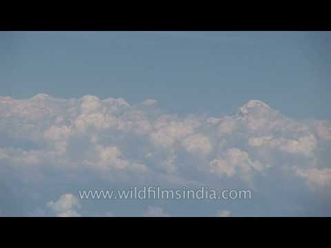 Sikkim's high peaks revealed through the clouds