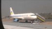 Air Deccan plane being boarded and Jet airways flight to Delhi taxiing at Kolkata Airport