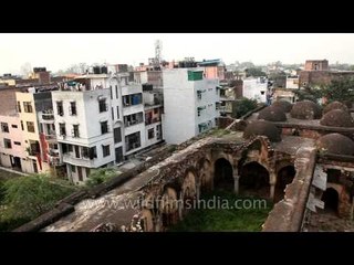 The old and the ugly new: Broad courtyard of Begampur mosque where the faithful gathered
