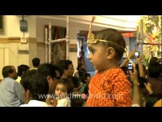 Child Krishna dances at Iskcon temple, Delhi, on Janmashtami