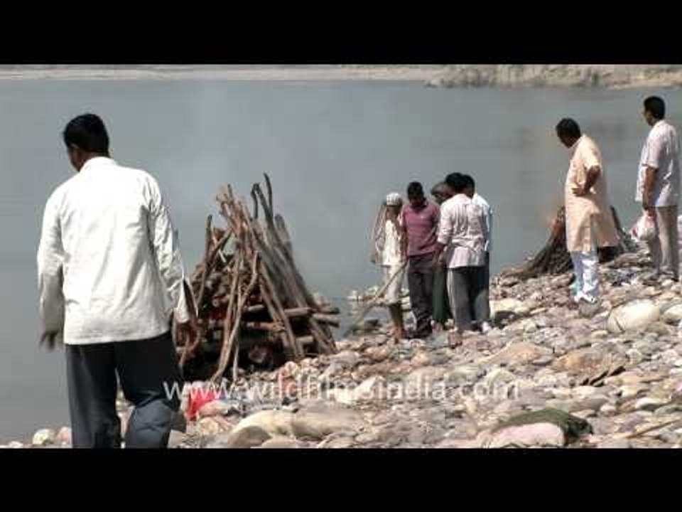 Hindus cremating dead bodies on the banks of the Ganges river in India
