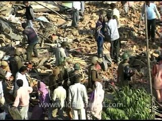 Gathering what the wreckers left behind after house demolition