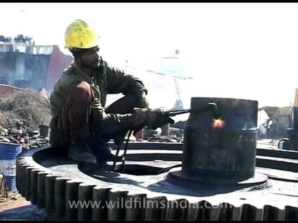 Welding at the ship recycling yard in Alang