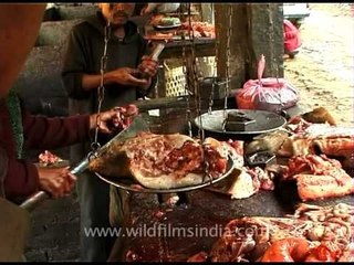 Butcher chops the pig into peices